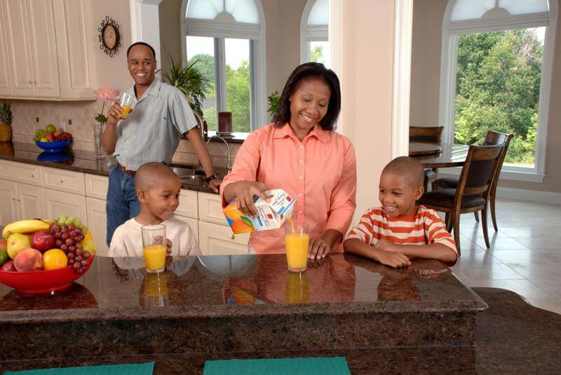 a family enjoying a meal, sober living near me, sober living america, sober living homes, sober living homes near me