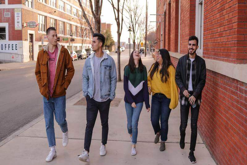 a group of five students walking, sober living house, sober living houses near me, what is a sober living house