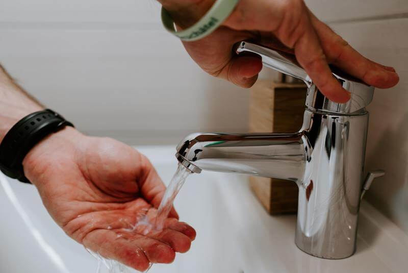 a man washing his hands as a coronavirus preventive measure, recovery homes in santa monica, halfway house los angeles