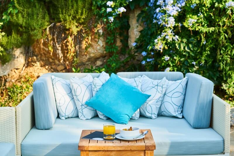 sky blue couch with a pillow, sober living los angeles, couples sober living, sober living house los angeles